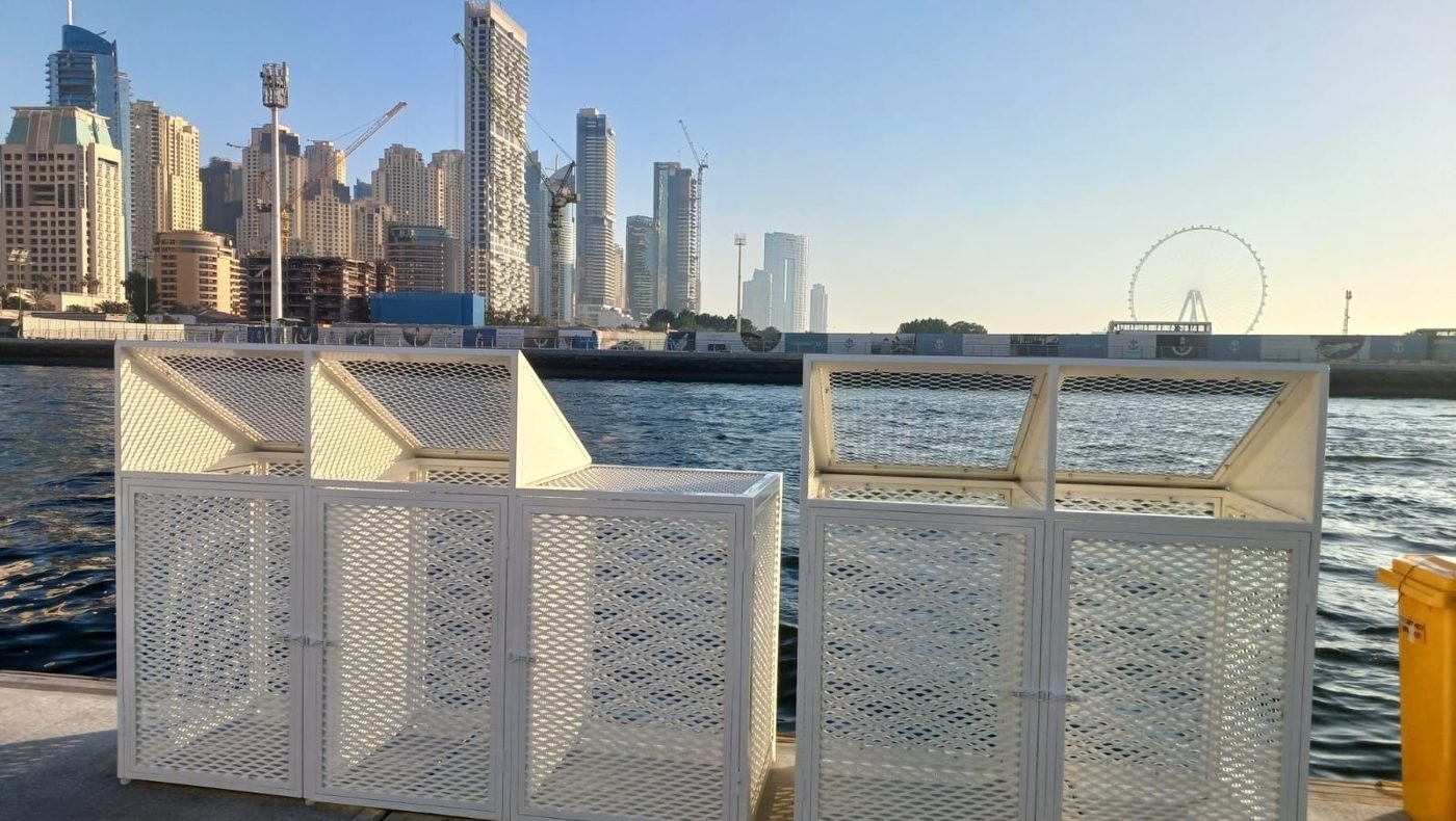 White powder-coated expanded-mesh enclosures on the promenade at Dubai Harbour