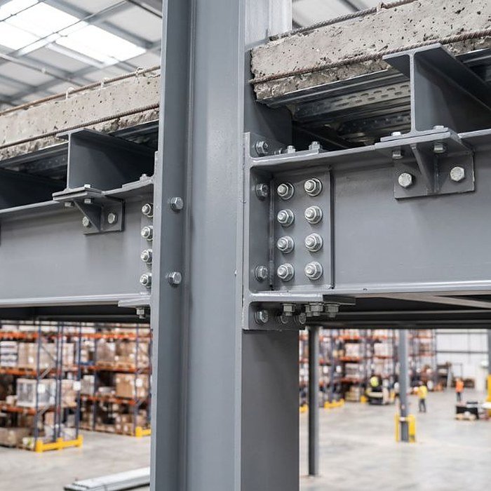 Steel column and beam connection on a completed frame